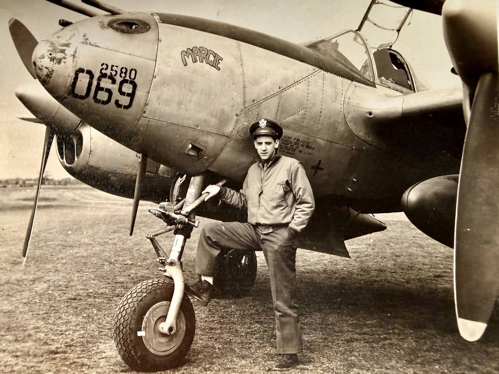 Lt. Jackson standing beside his P-38 Lightning, Margie
